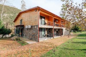 a large house with a brick yard in front of it at Bagdat Resort in Yalova