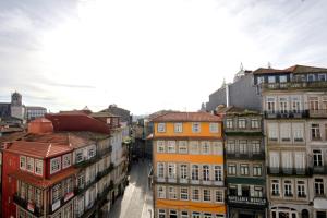 a group of buildings on a city street at Cardosas Square Luxury Apartments by Porto City Hosts in Porto