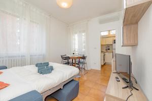 a bedroom with a bed and a television in it at Niguarda Hospital M5 Lilla 10 Home Away WiFi AC in Milan