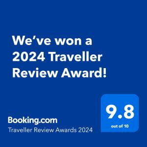 a text message with the words were won a traveler review award at Beautiful New Luxury Townhome with Private Beach and Swimming Pools in Ruskin