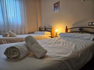 Ένα ή περισσότερα κρεβάτια σε δωμάτιο στο 22A02 Moderno apto Arriondas +27 φωτογραφίες