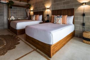 Ένα ή περισσότερα κρεβάτια σε δωμάτιο στο Punta Tokipa