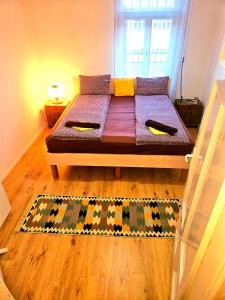 a bed with two pillows on it in a room at The heart of Sarajevo Apartment in Sarajevo