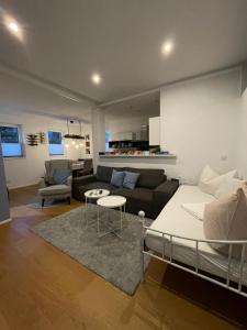 a living room with a couch and a table at Ferienwohnung Lieblingsplatzl in Wenns