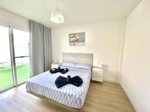 a bedroom with a bed with bow ties on it at Sofia35 in Costa Calma