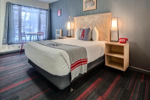 Letto o letti in una camera di A-Lodge Boulder