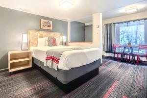 Letto o letti in una camera di A-Lodge Boulder