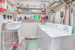 a laundry room with a washer and dryer at Colonial Heights Home with Large Yard and BBQ Grill! in Colonial Heights +17 photos