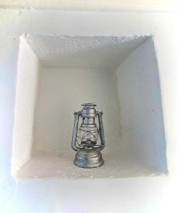 a small silver lantern in a white wall at Dar La Aicha in Chefchaouene