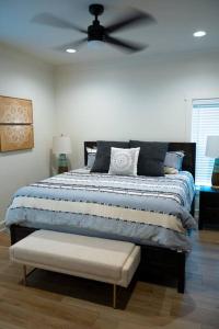a bedroom with a bed with a ceiling fan at New Modern Style Townhome in Sevierville