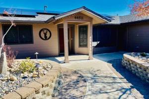 a house with a stone walkway in front of it at Deer Haven Hot Tub Foosball Pool Table in Ahwahnee