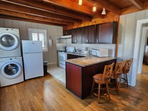 a kitchen with a washer and dryer at Eden Roc Apartments in Ocean City