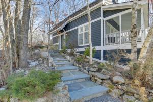 a home with stairs leading up to a house at Dreamy Hudson Valley Cottage with State Park Views in Garrison