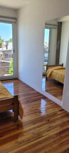 a room with two beds and a mirror at APARTAMENTOS FRERS in Martínez