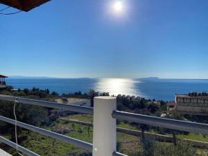 a view of the ocean from a building at Yard Paradise Rooms Dhermi in Dhërmi