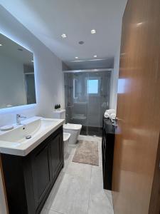 a bathroom with a sink and a toilet at Breathtaking Sunsets Flat in Las Palmas de Gran Canaria