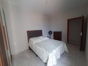 A bed or beds in a room at Apartamento Aconchego nas Montanhas, em Cunha-SP