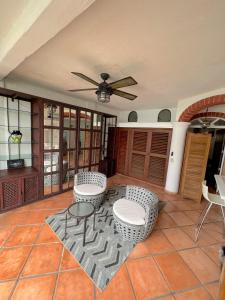a living room with two chairs and a table at Marboka Hotel & Suites in Puerto Vallarta