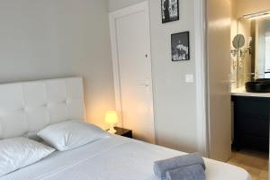 Posteľ alebo postele v izbe v ubytovaní Centre-ville 5mn Croisette