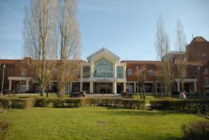 a university building with a lawn in front of it at Welwyn Garden City Apartment by Mantis in Welwyn Garden City