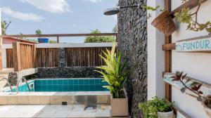 a swimming pool on the balcony of a house at Casa do Crush Jericoacoara-3 Suítes com piscina in Jericoacoara