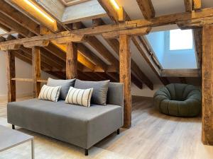 a living room with a couch and a chair at Fomento by Wynwood House in Madrid