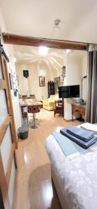 a bedroom with a bed and a living room at The Stable, Bennettsbridge, Kilkenny in Bennettsbridge