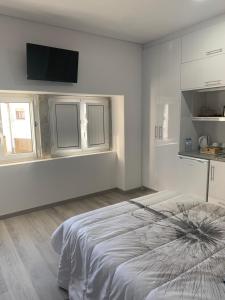 Un ou plusieurs lits dans un hébergement de l'établissement Casa da Moagem