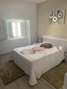 Un ou plusieurs lits dans un hébergement de l'établissement Casa da Moagem