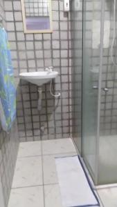 a bathroom with a sink and a shower at Hostel Brasil Recife in Recife