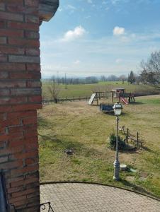 a view of a park with a playground at Private Room in the Food Valley of Parma in Montechiarugolo