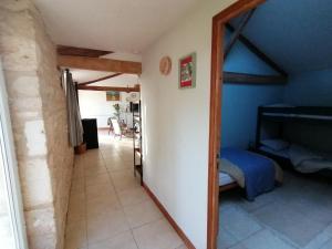 a hallway in a house with a bed and a mirror at Lodge in Saint-Ciers-Sur-Bonnieure in Saint-Ciers-sur-Bonnieure +43 photos