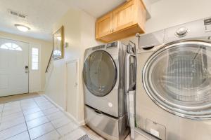 a laundry room with a washer and dryer at Quiet Vacation Rental in Peachtree City with Yard! in Peachtree City