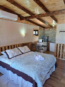 a bedroom with a large bed in a room at Hostal Robinson in Puerto Puyuhuapi