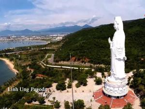 a large statue of a man on top of a hill at Vinh Trung Plaza Hotel in Danang