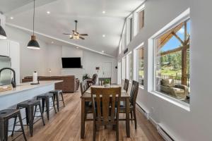 a kitchen and living room with a table and chairs at Welcome! 4 bedroom (6 bed) 3 bath River House 