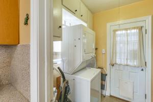 a kitchen with a washer and dryer in a room at Charming Bungalow Near LA Waterfront and Beaches in San Pedro