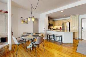 a kitchen and dining room with a table and chairs at Seasons Lodge #101 in Edwards