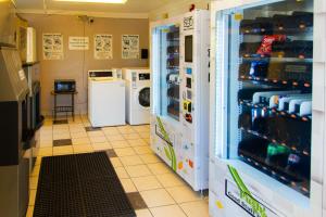 a laundry room with a washer and dryer at Motel 6-Lantana, FL in Lantana