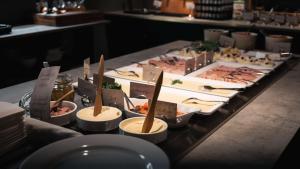 a buffet of food on a table in a restaurant at Hotell Boras, BW Signature Collection in Borås