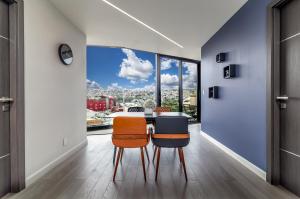 a dining room with a view of the city at Tijuana Luxury 2B Amazing Views Estadio Caliente in Tijuana +18 photos