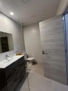 a bathroom with a shower and a sink and a toilet at Lola in Gran Tarajal +9 photos