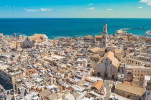an aerial view of a city with the ocean at La Maison di Serena in Bari