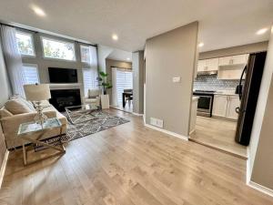 a living room with a couch and a table at B’s King Suite in Ottawa