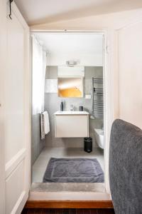 a small bathroom with a sink and a toilet at Penthouse Le Terrazze Duomo view in Florence