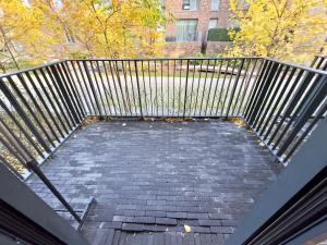 a walkway with a metal railing on top of it at London Luxury flat with Balcony, O2 Arena, Excel, Canary Wharf, Station in London