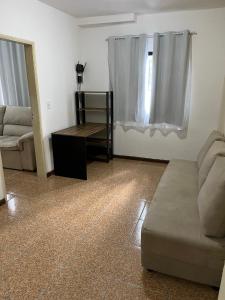 a living room with a couch and a table at Apartamento Boa Vista in Garanhuns