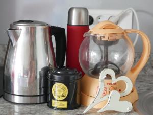 a kitchen counter with a blender and a coffee maker at STUDIO Coquillages&Crustacés in Le Gosier