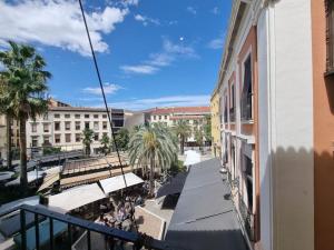 a view from a balcony of a street with buildings at Exclusividad a Pie de la Torre de la Catedral in Granada