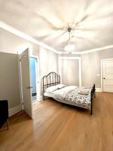 a bedroom with a bed and a ceiling at O Canada Guest House in Toronto